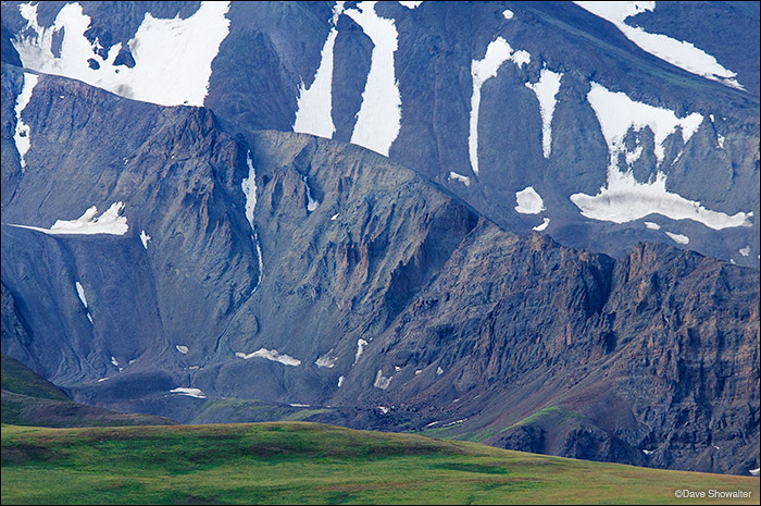 The imposing grante wall on the north face of Francs Peak (13,153') contrasts sharply with summer green on Phelps Mountain. Francs...