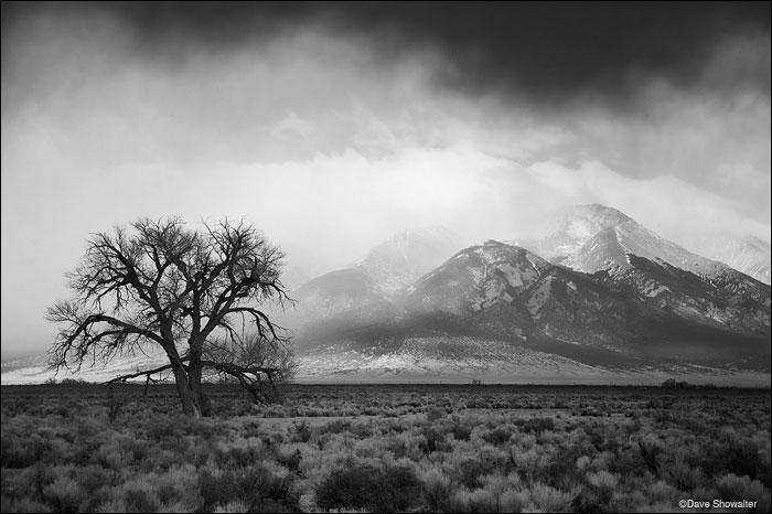 &nbsp;A spring storm passes the Blanca group in the southern Sangre De Cristo Range as sun lights the base of the mountains....