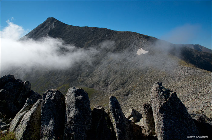 &nbsp;Culebra Peak (14,069') encircled by morning clouds from a high approach ridge. Culebra is on the Cielo Vista Ranch the...