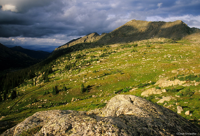 A thunderstorm passes in the valley below Holy Cross Ridge in Holy Cross Wilderness.