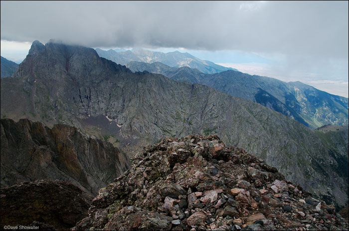 &nbsp;Low clouds envelop the summits of Crestone Peak (14,294') and Crestone Needle (14,191') in this view from Kit Carson Mountain...