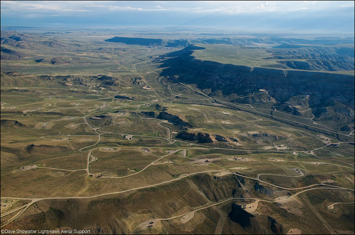 &nbsp;The aerial perspective shows a fractured landscape and spiderweb of roads in the LaBarge Gas Field. This landscape has...