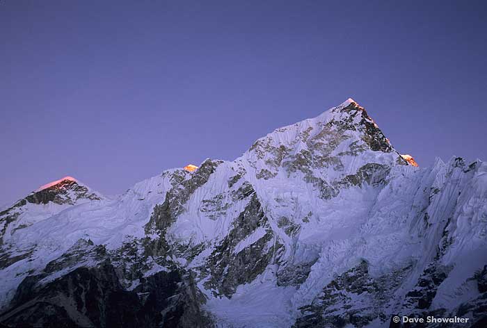 Sunset grazes the peak of Nuptse, 7,881 meters high in the Himalayas of Nepal. Peaks of Everest and Lhotse are to the left and...