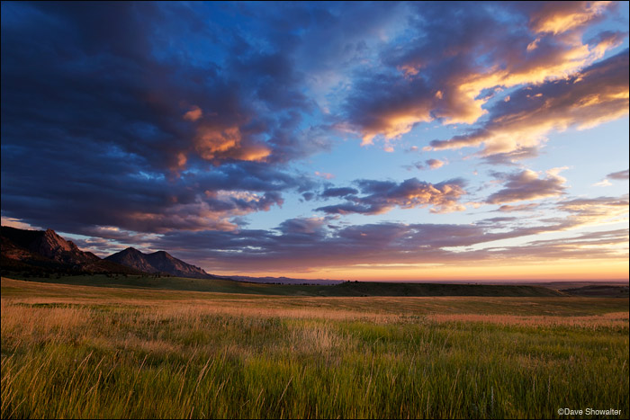 Sunrise lights the cloudscape over the Flatirons near Boulder, Colorado. Jefferson County and Boulder County have done a great...