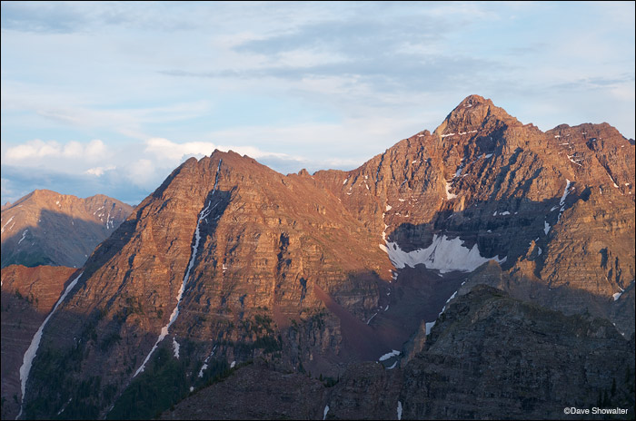 Pyramid Peak (14,018') glows in evening light in this view from Sievers Mountain. Pyramid is one of Colorado's most challenging...