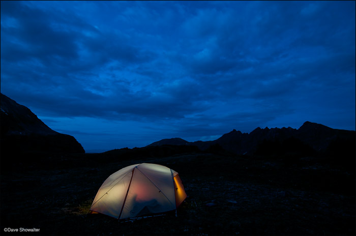 Sievers Mountain (12,773') is the jagged backdrop for our glowing tent in this twilight scene near Willow Lake.&nbsp;