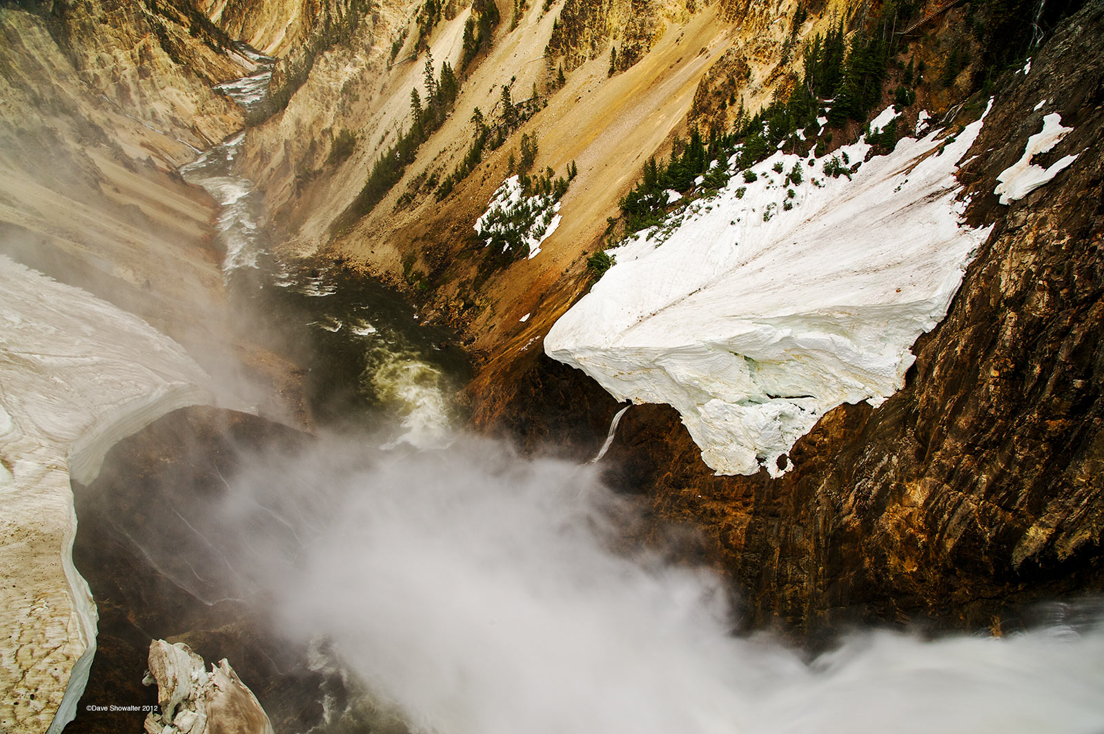 The Yellowstone River plunges over the Lower Falls during spring runoff, a time to be awestruck by the power of water. Yellow...