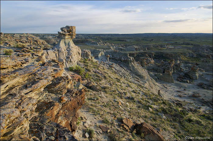 A warm June sunrise lights the rugged rock formation in Adobe Town, the heart of Wyoming's southern Red Desert. This wilderness...