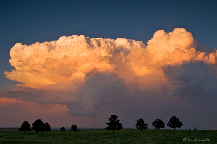 A massive anvil cloud catches sunset light over the James Crain Prairie near Boulder. In late spring and summer, these clouds...