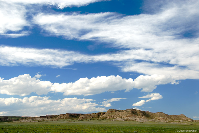 Puffy White clouds drift over the Chalk Bluffs late one summer afternoon. The Chalk Bluffs provide important nesting habitat...