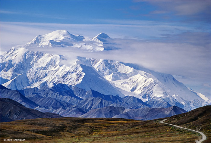 Denali (Mt. McKinley) rises high above the arctic tundra. The lone road through the park adds scale to this massive peak. Denali...