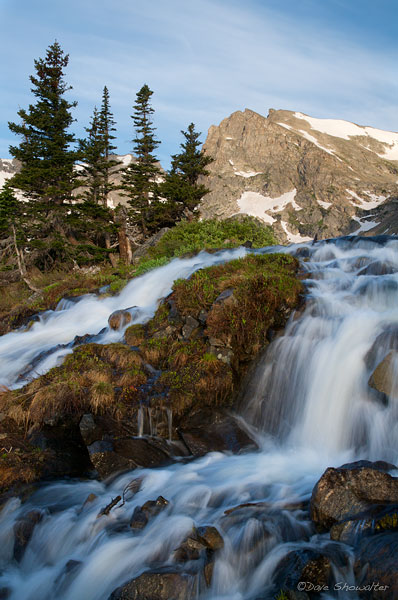 In early July, the winter snowpack is melting rapidly and water is rushing from the Colorado mountains. This perspective is just...