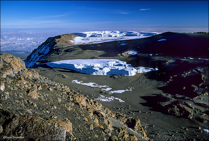 Crater glaciers are seen from the summit of Kilimanjaro, 19,340'. Our guide told us that these glaciers, now destined to disappear...