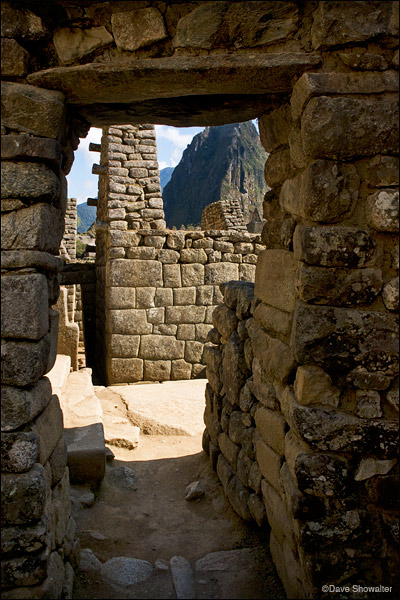 A doorway in the ruins at Machu Picchu leads to a view within the ancient Inca complex.