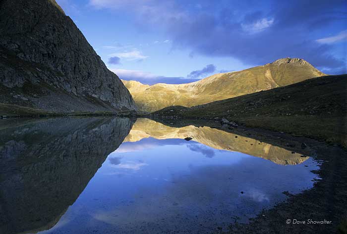 Whitecross Mountain, 13,542' is reflected in an alpine tarn just after sunrise.&nbsp;