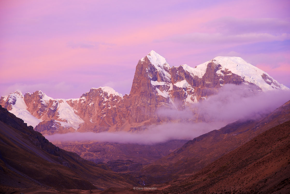 Sunset paints sky and Cuyoc (5560m) in shades of magenta and pink from our camp along the Huauhuash trek.&nbsp;