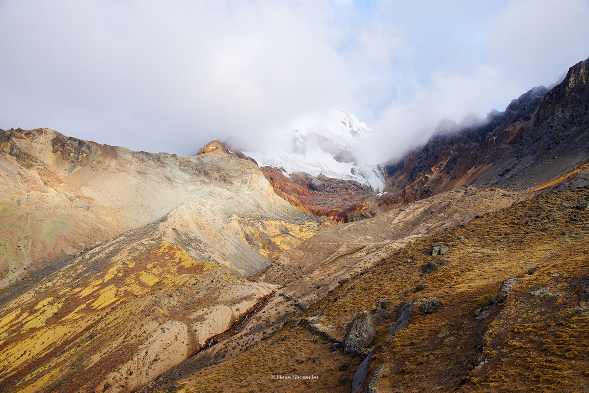 Sun breaks through clouds to light Diablo Mudo (5223m) after an afternoon of spitting snow. We climbed the mountain with our...