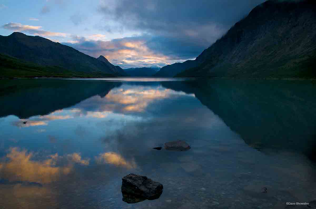 &nbsp;A clearing storm reflects in the calm waters of Gjende, a massive glacial lake in Jotunheimen Nasjonal Park. We were just...