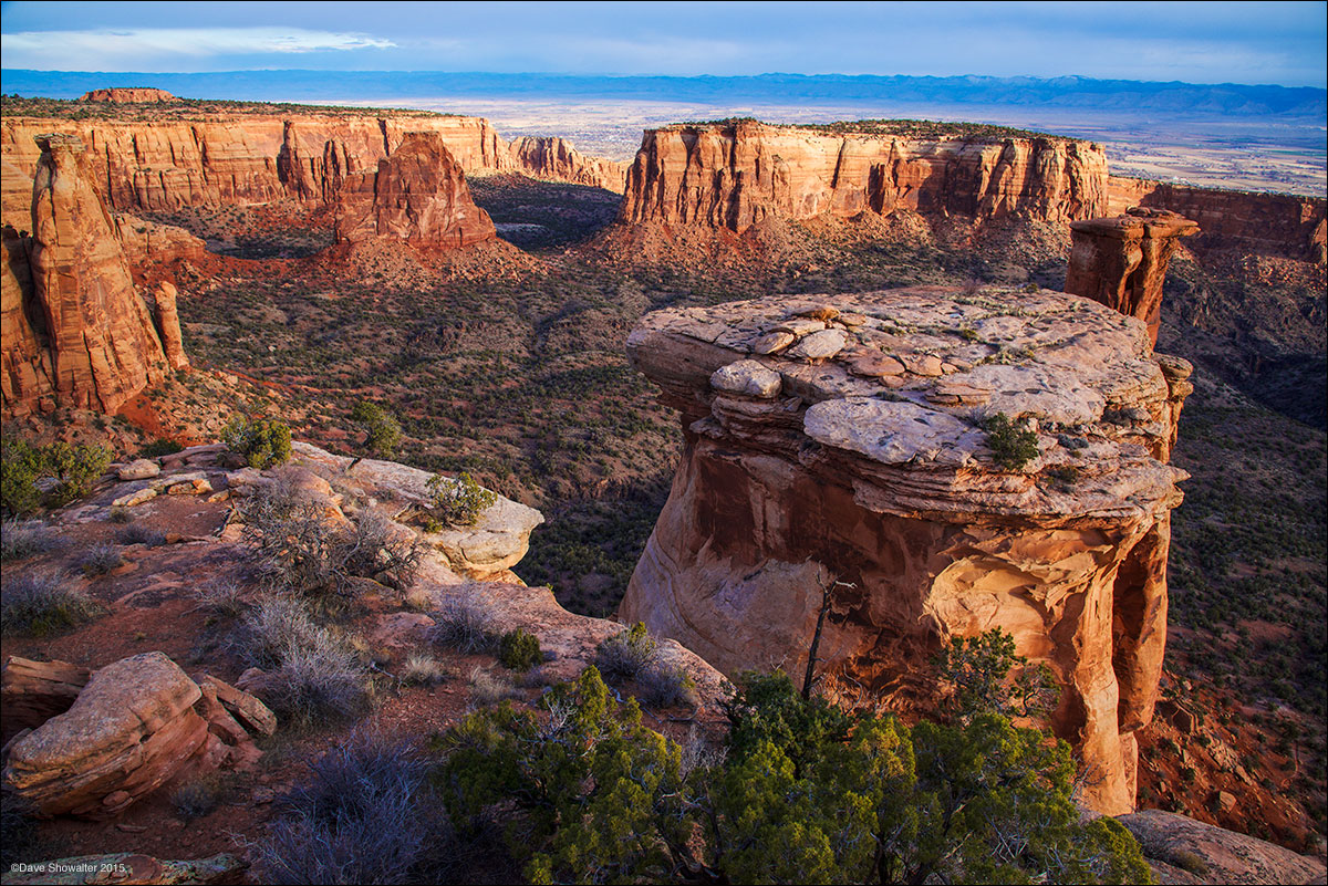 Morning light illuminates towering monuments of stone and rimrock above Colorado's Grand Valley. It's fascinating to study miniature...