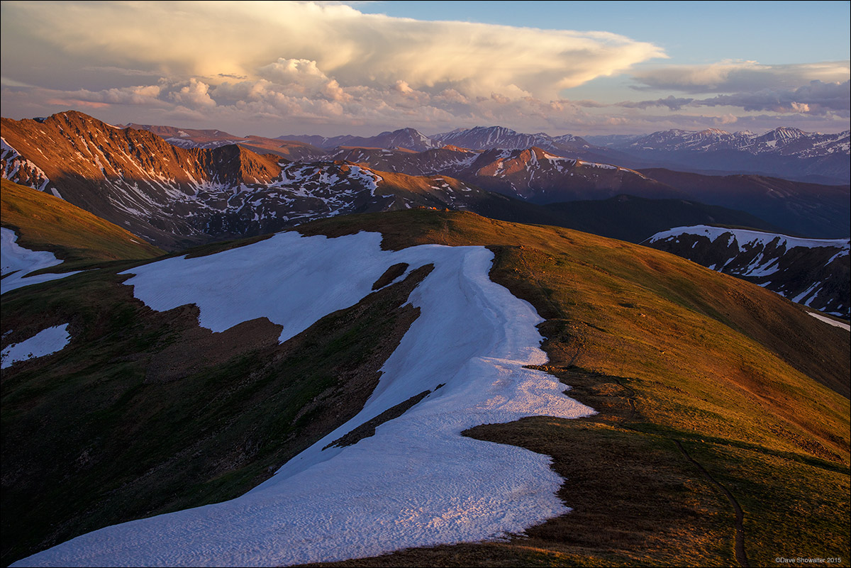 As the setting sun dipped below a drifting storm cloud, the high tundra and 13,000 foot giants of the Front Range and Tenmile...