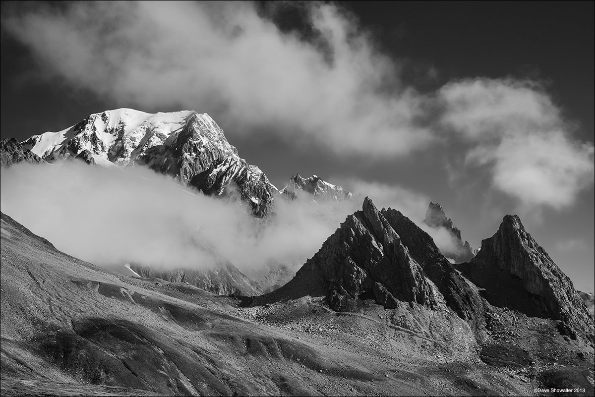 Mont Blanc (15,782') peeks in and out of clouds swirling around the summit from Col De la Seigne (8,254'). The image was made...