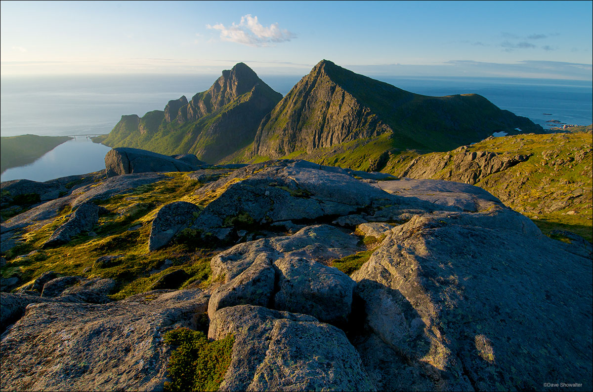 &nbsp;Merraflestinden and Gylltinden (mountains) absorb early morning light from high on the island of Moskenesoya. The mountains...