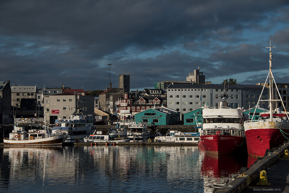 Colorful boats reflect in Reykjavik Harbor in Iceland's capital city.&nbsp;Iceland is home to 350,000 people, about 200,000 of...