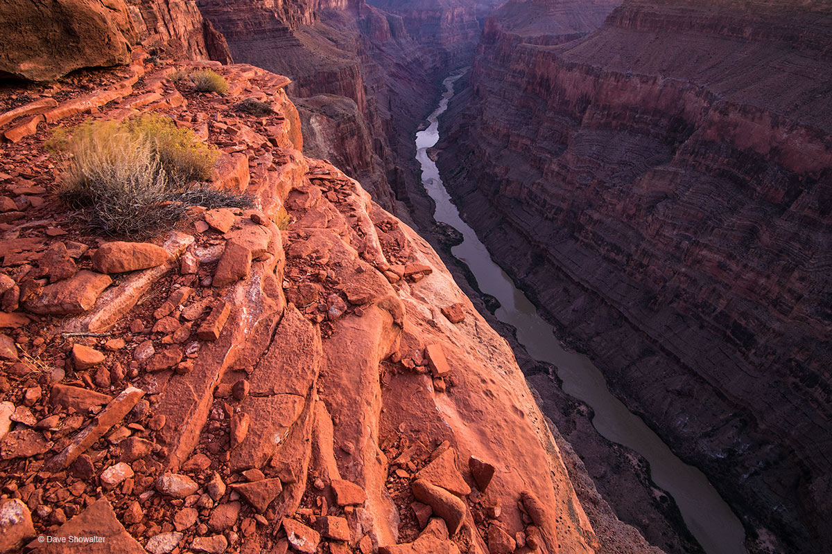 Three thousand feet directly below one's feet, the Colorado River flows in a thin line at Toroweap, a remote spot on the North...