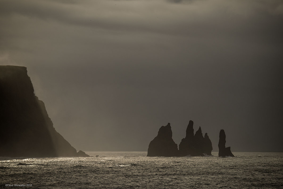 Basalt Reynisdrangar Sea Stacks rise from the sea just off the coastal Village of Vik. Icelandic legend tells the story of trolls...