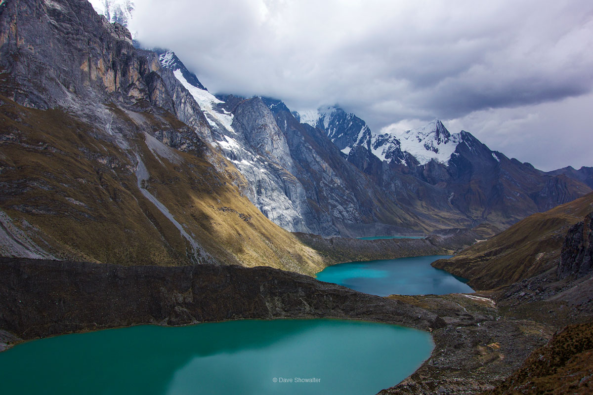 The route to Siula Pass (4800m) travels over rugged terrain below Andes giants and past three turquoise Andes lakes. Laguna Quesillucocha...