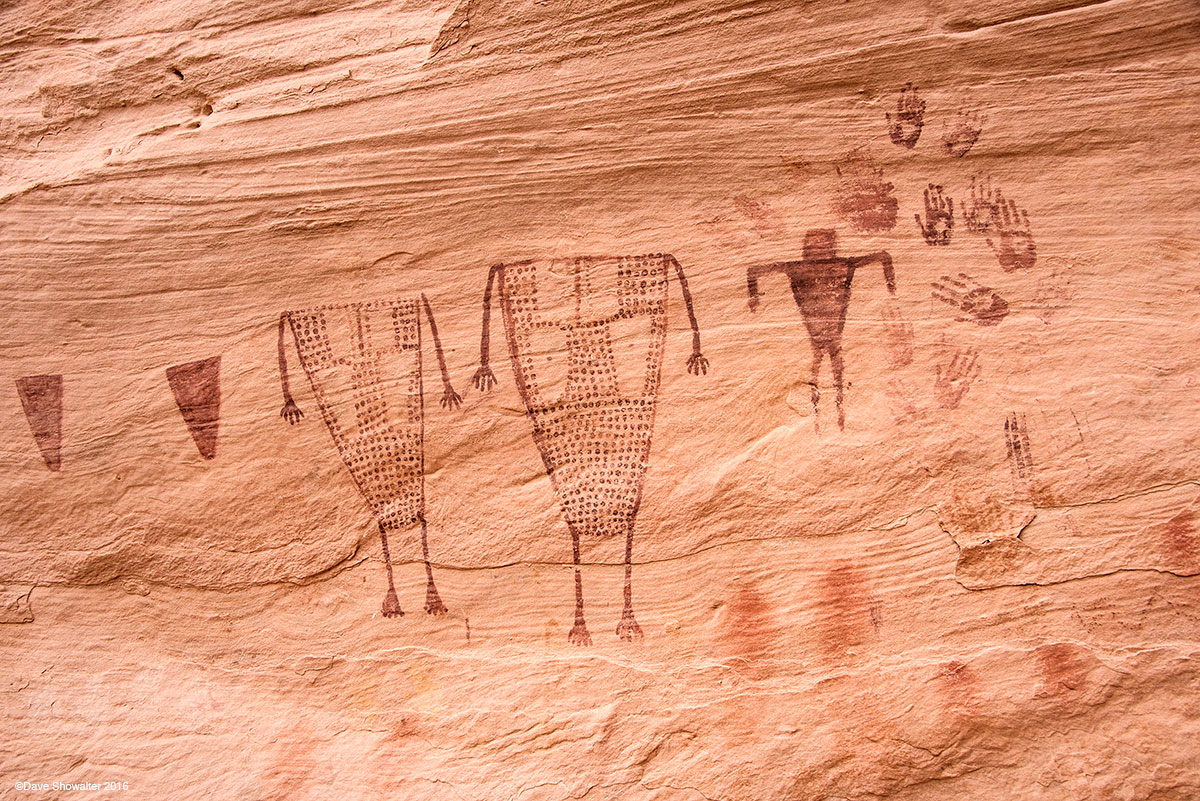 In Sheik's Canyon, deep in Grand Gulch is this stunning pictograph panel of headless anthropomorphic figures and human hand imprints...